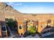 Beautiful multi-story townhome featuring rich colors, a turret, and lush landscaping at 3975 N Hualapai Way # 212, Las Vegas, NV 89129