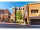 Beautiful townhome with a turret architectural design and mature landscaping at 3975 N Hualapai Way # 212, Las Vegas, NV 89129