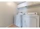 A dedicated laundry room with a white washer and dryer at 3975 N Hualapai Way # 212, Las Vegas, NV 89129
