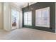 Bright living room featuring plush carpet, shutters, and sliding glass door at 3975 N Hualapai Way # 212, Las Vegas, NV 89129