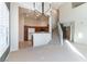 Open living room featuring a view into the kitchen and staircase at 3975 N Hualapai Way # 212, Las Vegas, NV 89129