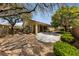 Expansive backyard features desert landscaping and an extended covered patio, perfect for outdoor living at 4217 Box Canyon Falls Ave, North Las Vegas, NV 89085
