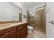 Modern bathroom featuring vanity with storage, a glass enclosed shower, and tiled floor, offering a clean and updated space at 4217 Box Canyon Falls Ave, North Las Vegas, NV 89085