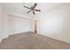 Bedroom featuring a ceiling fan and closet doors at 4217 Box Canyon Falls Ave, North Las Vegas, NV 89085
