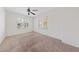 Bedroom featuring a ceiling fan, carpet, and white shuttered windows at 4217 Box Canyon Falls Ave, North Las Vegas, NV 89085