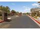 Gated community entrance providing security and privacy, with well-maintained landscaping at 4217 Box Canyon Falls Ave, North Las Vegas, NV 89085