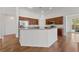 Kitchen view with wood cabinets, stainless steel refrigerator and granite countertops at 4217 Box Canyon Falls Ave, North Las Vegas, NV 89085