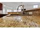 Up close view of beautiful granite countertop with sink and faucet in kitchen at 4217 Box Canyon Falls Ave, North Las Vegas, NV 89085