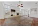 Open living room with fireplace and bright windows, perfect for gatherings at 4217 Box Canyon Falls Ave, North Las Vegas, NV 89085
