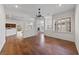 Open-concept living room with hardwood floors, recessed lighting and a view of the kitchen at 4217 Box Canyon Falls Ave, North Las Vegas, NV 89085