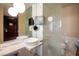 Sleek bathroom with dual vessel sinks, modern fixtures, a glass partition, and a convenient toilet at 4381 W Flamingo Rd # 1504, Las Vegas, NV 89103