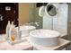 Modern dual sink bathroom with marble counter at 4381 W Flamingo Rd # 1504, Las Vegas, NV 89103