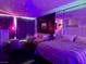 This modern bedroom is decorated with star lights, a large mirror and a comfortable sitting area at 4381 W Flamingo Rd # 1504, Las Vegas, NV 89103