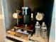 Coffee station with a Keurig coffee maker and alkaline water bottles at 4381 W Flamingo Rd # 1504, Las Vegas, NV 89103