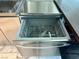 Stainless steel dishwasher with an open door, revealing the interior racks at 4381 W Flamingo Rd # 1504, Las Vegas, NV 89103