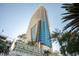 Daytime shot of Palms Place tower, highlighting modern architecture against a clear sky with greenery at 4381 W Flamingo Rd # 1504, Las Vegas, NV 89103