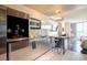 Modern kitchen featuring stainless steel appliances and bar counter, leading to the bedroom at 4381 W Flamingo Rd # 1504, Las Vegas, NV 89103
