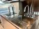 Modern kitchen featuring a stainless steel sink, countertop and electric cooktop at 4381 W Flamingo Rd # 1504, Las Vegas, NV 89103