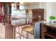 Modern kitchen featuring stainless steel appliances and a bar counter with a stool at 4381 W Flamingo Rd # 1504, Las Vegas, NV 89103