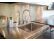 Modern kitchen featuring a stainless steel sink, countertop and backsplash at 4381 W Flamingo Rd # 1504, Las Vegas, NV 89103