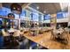 Bright restaurant with floor-to-ceiling windows, contemporary decor, fireplace, and various seating options at 4381 W Flamingo Rd # 1504, Las Vegas, NV 89103
