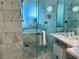 Modern shower with marble tile and bath at 4381 W Flamingo Rd # 1504, Las Vegas, NV 89103