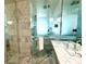 Modern shower with marble tile and bath at 4381 W Flamingo Rd # 1504, Las Vegas, NV 89103