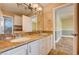 Bathroom features dual sinks, granite counters, and a large mirror at 4775 N Grand Canyon Dr, Las Vegas, NV 89129