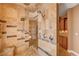 Corner tile shower with rainfall shower head and granite bench seating at 4775 N Grand Canyon Dr, Las Vegas, NV 89129