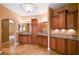 Bathroom with dual sink vanity, granite countertop, custom lighting, and tiled floor at 4775 N Grand Canyon Dr, Las Vegas, NV 89129