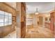 Large bathroom with walk-in shower, soaking tub, granite counters and tile flooring at 4775 N Grand Canyon Dr, Las Vegas, NV 89129