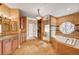 Spacious bathroom featuring dual shower, soaking tub with tile surround, and dual sink vanity at 4775 N Grand Canyon Dr, Las Vegas, NV 89129