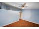 Bright bedroom featuring a loft space, neutral walls, tile floors, and a ceiling fan at 4775 N Grand Canyon Dr, Las Vegas, NV 89129
