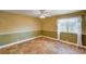 Spacious bedroom with neutral walls, tile floors, and a bright window at 4775 N Grand Canyon Dr, Las Vegas, NV 89129