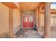 Covered front porch featuring stone accents, decorative tiling and a double-door front entrance at 4775 N Grand Canyon Dr, Las Vegas, NV 89129