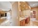 Hallway shows a vanity, and a view of the living room, displaying the open concept design of the home at 4775 N Grand Canyon Dr, Las Vegas, NV 89129