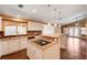Spacious kitchen with granite counters, central island, and white cabinets at 4775 N Grand Canyon Dr, Las Vegas, NV 89129