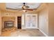 Living room features travertine floors, a decorative fireplace with mantle, and access to the backyard at 4775 N Grand Canyon Dr, Las Vegas, NV 89129