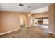 Open living room featuring neutral paint, archways, and a view to the stone fireplace at 4775 N Grand Canyon Dr, Las Vegas, NV 89129