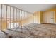 Cozy loft space featuring neutral carpeting, painted walls, and bright natural light from the staircase railing at 4775 N Grand Canyon Dr, Las Vegas, NV 89129
