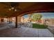 Stunning backyard featuring a custom pool with rock features, lush landscaping, and a serene atmosphere at 4775 N Grand Canyon Dr, Las Vegas, NV 89129