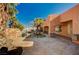 Resort-style backyard with a custom pool featuring rock accents, a slide, and mature palm trees for a tropical oasis at 4775 N Grand Canyon Dr, Las Vegas, NV 89129