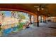 Inviting outdoor space with a custom pool featuring rock waterfall and slide, perfect for relaxation and entertainment at 4775 N Grand Canyon Dr, Las Vegas, NV 89129