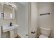 Bathroom featuring a modern vanity, toilet, and walk-in shower at 4804 Apawana Ln, Las Vegas, NV 89108
