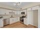 Contemporary kitchen features stainless appliances, white cabinets, and a sleek design at 4804 Apawana Ln, Las Vegas, NV 89108