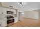 Well-lit kitchen with stainless steel appliances and ample counter space at 4804 Apawana Ln, Las Vegas, NV 89108