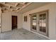 Covered patio featuring a side utility room and french doors for easy access to the backyard at 4804 Apawana Ln, Las Vegas, NV 89108