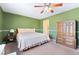 Bedroom featuring neutral carpet, a queen bed, and a wooden dresser at 502 Cosmic Star Pl, Henderson, NV 89052
