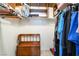 Closet with hanging clothes and a wooden chest at 502 Cosmic Star Pl, Henderson, NV 89052