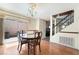 Well-lit dining room featuring wood floors and a glass sliding door at 502 Cosmic Star Pl, Henderson, NV 89052
